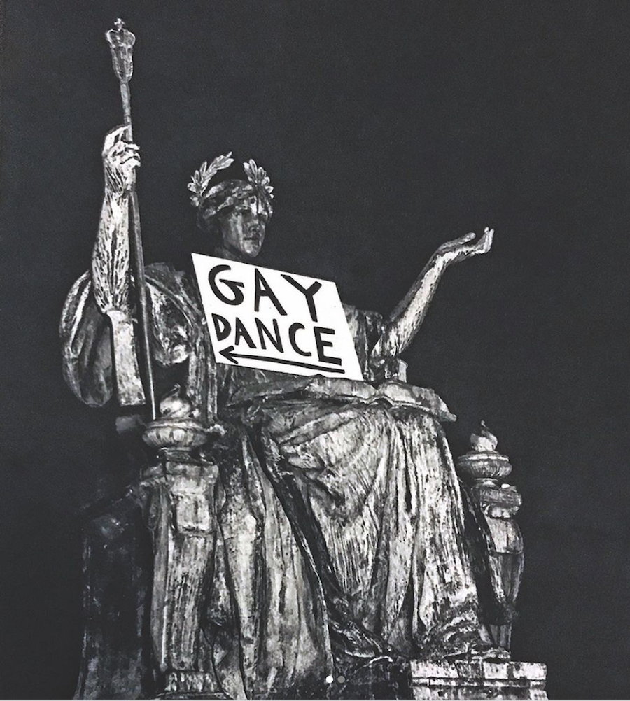 Alma Mater with a sign that read "Gay Dance" with an arrow, pointing to Earl Hall.