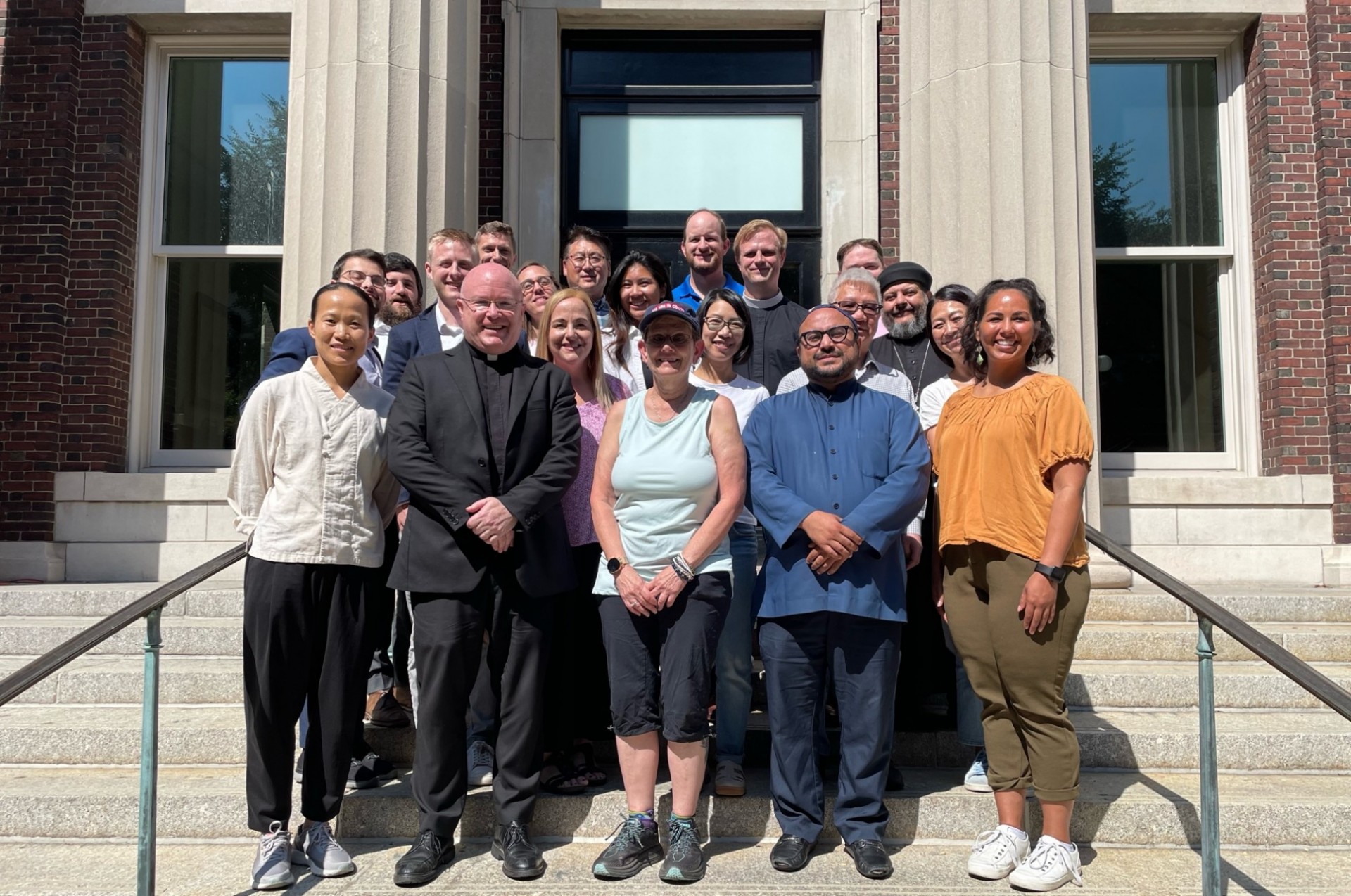 Our diverse religious life advisers on the stairs that lead up to Earl Hall. 