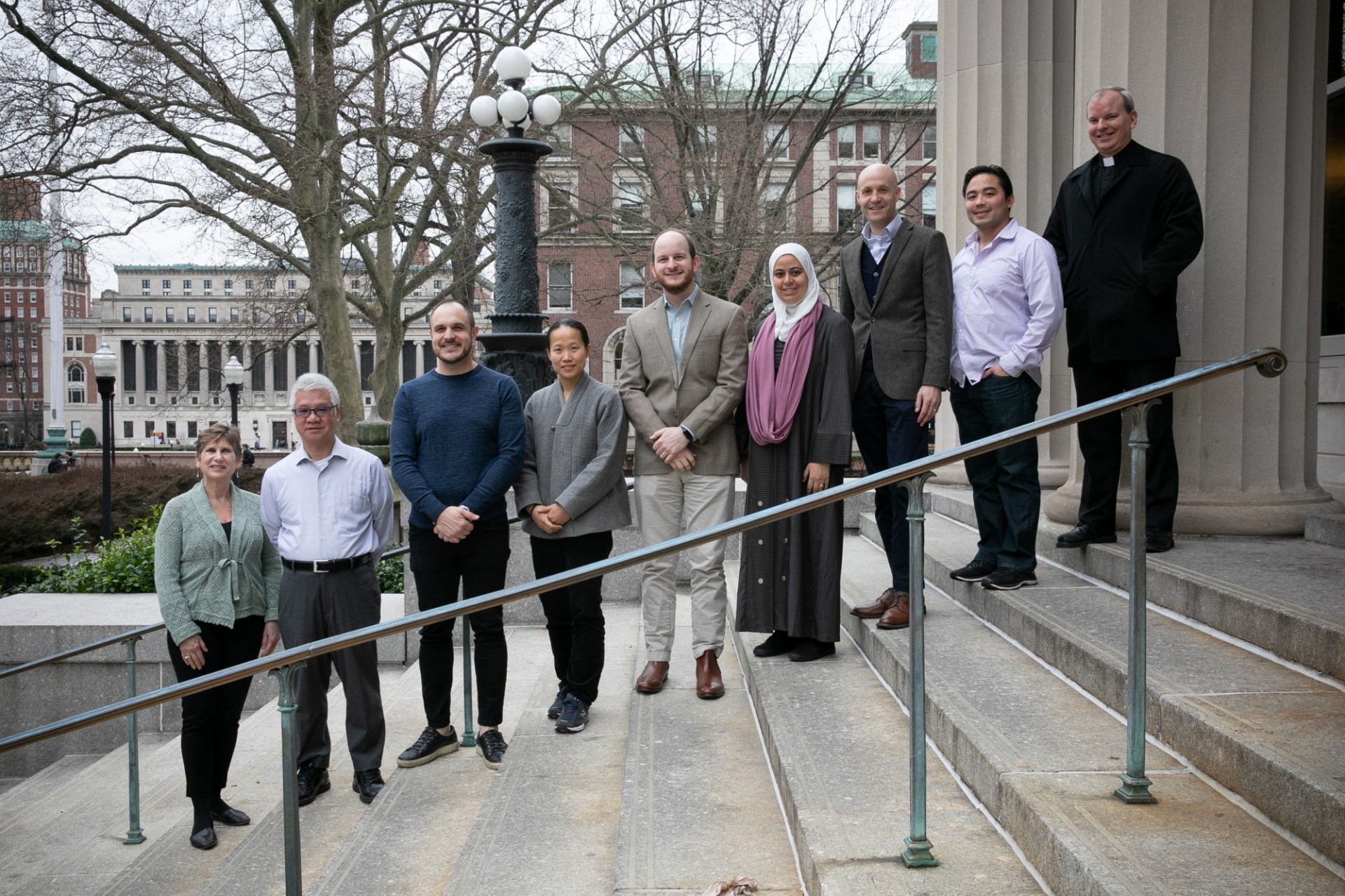 Our diverse religious life advisers on the stairs that lead up to Earl Hall. 