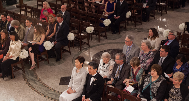 Wedding guests sitting in the chairs in the Chapel.