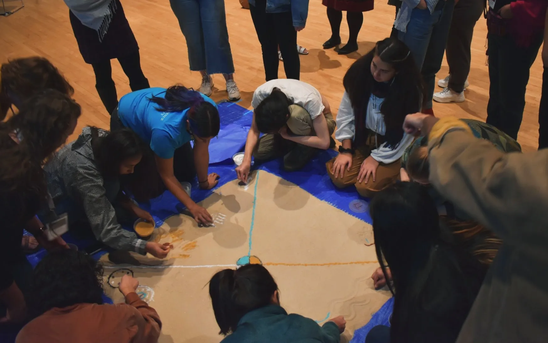 Students participants in a sand mandala workshop at the Ivy Native Council that was co-sponsored by Columbia Religious Life. 